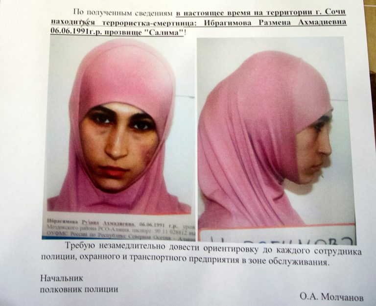 A photo of a police leaflet seen in a Sochi hotel on Tuesday, Jan. 21, 2014, shows Ruzanna Ibragimova and states that she is at large in the city of Sochi. Russian security officials are hunting down three potential female suicide bombers, one of whom is believed to be in Sochi, where the Winter Olympics will begin next month. Police leaflets seen by an Associated Press reporter at a central Sochi hotel on Tuesday contain warnings about three potential suicide bombers. Police said that Ruzanna Ibragimova, depicted in a mug shot wearing a pink hijab, was at large in Sochi. (AP Photo/Natalya Vasilyeva)