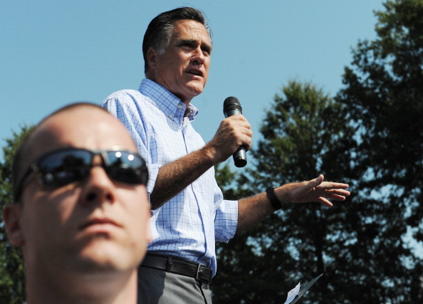 A Secret Service agent looks on as Republican presidential candidate Mitt Romney speaks at a campaign rally in Fairfax. (Getty Images)