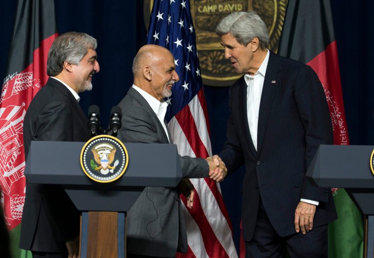 Secretary of State John Kerry, right, shakes hands with Afghan Chief Executive Abdullah Abdullah, left, and Afghan President Ashraf Ghani after a news conference at Camp David Presidential retreat, on Monday, March 23, 2015, in Camp David, Md. (AP Photo/ Evan Vucci)