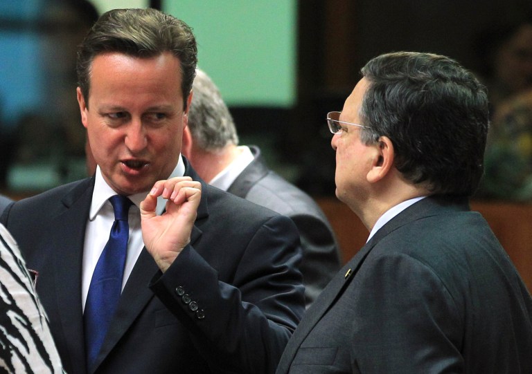 European Commission President Jose Manuel Barroso, right, talks with British Prime Minister David Cameron, during an EU Summit meeting in Brussels on Friday, June 27, 2014. European Union leaders are set to nominate former Luxembourg Prime Minister Jean-Claude Juncker to become the 28-nation blocâs new chief executive despite strong British opposition. The leaders at their summit Friday in Brusssels planned to elect Juncker with overwhelming majority as the candidate they will propose to the European Parliament. (AP Photo/Yves Logghe)