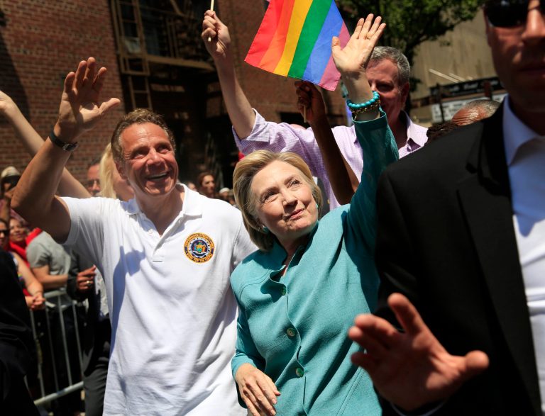Democratic presidential candidate Hillary Clinton, center, marches with New York Gov. Andrew Cuomo, left, in the New York City Pride Parade in New York, Sunday, June 26, 2016. (AP Photo/Seth Wenig)