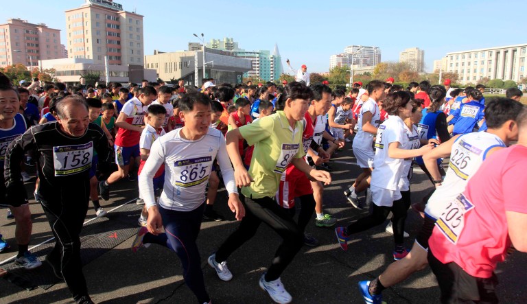 Runners competed in a half-marathon in Pyongyang Sunday. A small group of foreign runners joined the amateur race in North Korea in spite of heightened tensions surrounding the Korean peninsula. (AP Photo/Jon Chol Jin)