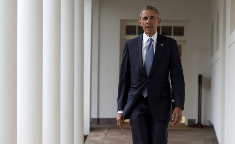 President Barack Obama walks along the colonnade of the White House in Washington, Tuesday, Jan. 12, 2016, to the residence from the Oval Office, hours before giving his State of The Union address. (AP Photo/Carolyn Kaster)