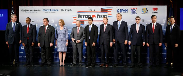 Republican presidential candidates gather on stage before a forum Monday, in Manchester, N.H. From left: Jeb Bush, Ben Carson, Chris Christie, Carly Fiorina, Lindsey Graham, Bobby Jindal, John Kasich, George Pataki, Rick Perry, Rick Santorum and Scott Walker. (AP Photo/Jim Cole)