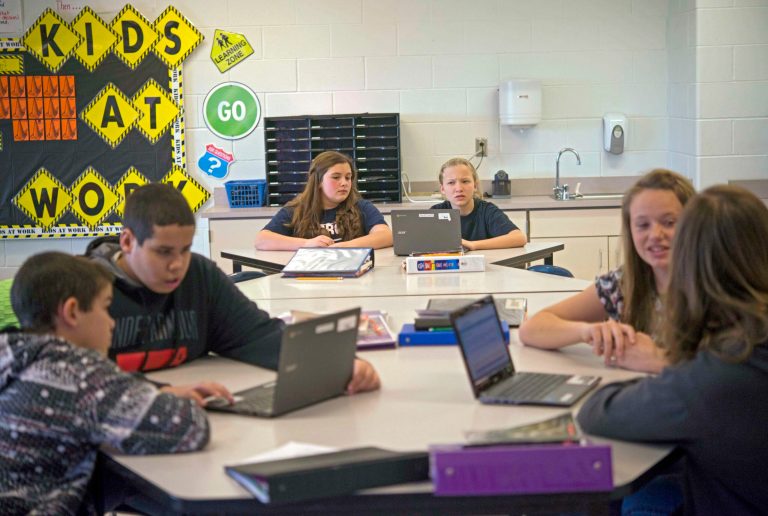 Students in Carrie Young's sixth grade class work through an exercise on their laptops practicing for the the Common Core State Standards Test at Morgan Elementary School South in Stockport, Ohio on Thursday, February 12, 2015. (AP Photo/Ty Wright)