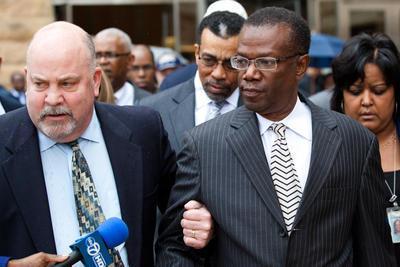 Jack Johnson walks out of the U.S. District Court in Maryland with his lawyer Jeff Harding, Maryland, Greenbelt, Tuesday, Dec 6, 2011