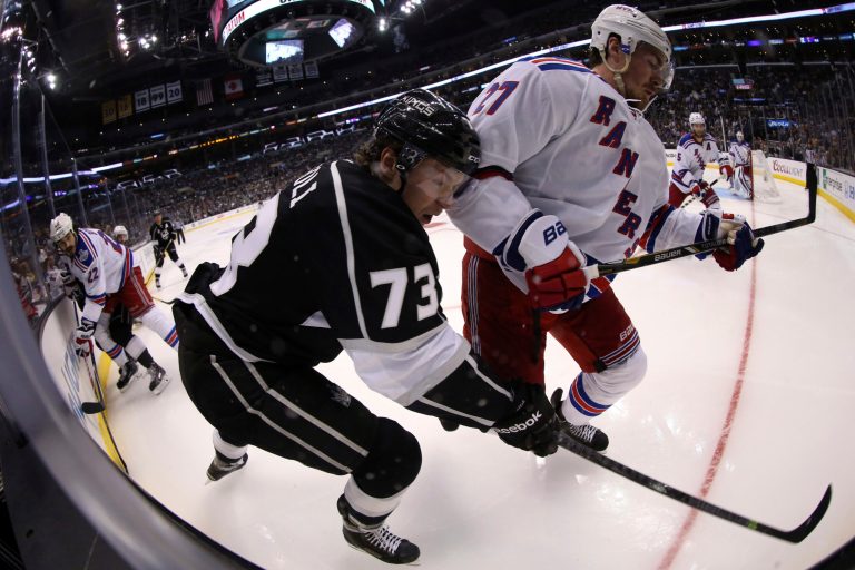 Tyler Toffoli of the Los Angeles Kings goes after the puck alongside Ryan McDonagh of the New York Rangers in the third period during Game One of the 2014 NHL Stanley Cup Final at the Staples Center on June 4, 2014 in Los Angeles, California. (Photo by Bruce Bennett/Getty Images)