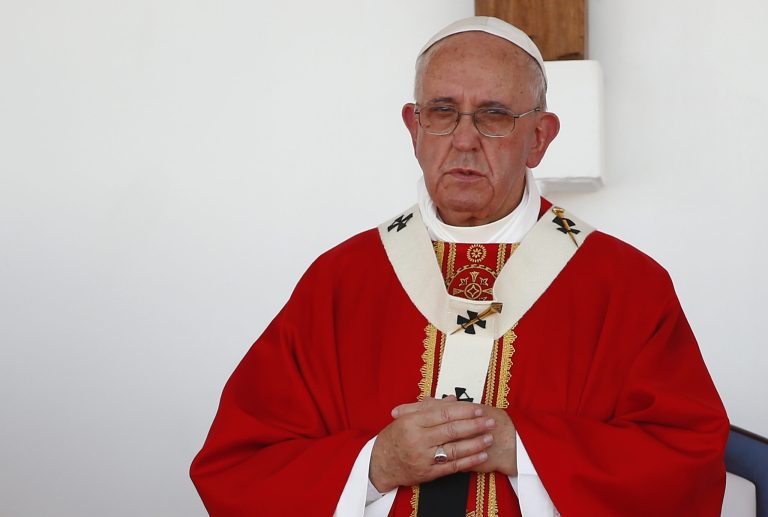 Pope Francis stands on the altar during a Mass in Holguin, Cuba, Monday. (Tony Gentile/Pool via AP)