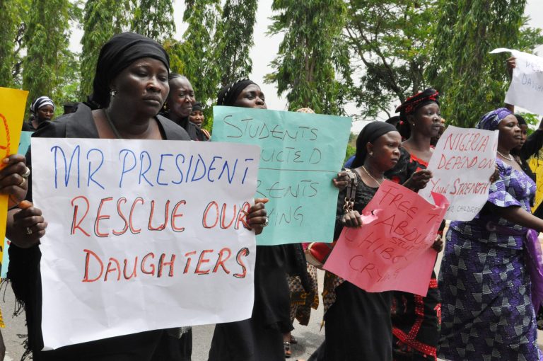 Unidentified mothers call for the president to help, during a demonstration with others who have daughters among the kidnapped school girls of government secondary school Chibok on Tuesday in Abuja, Nigeria. (AP Photo/Gbemiga Olamikan)