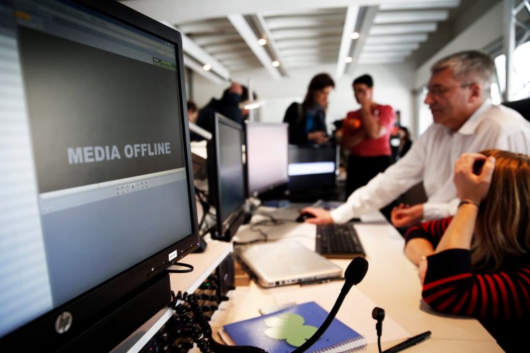 TV5 employees work after the French television network was hacked by people claiming allegiance to the Islamic State group, in Paris, France, Thursday April 9, 2015. (AP Photo/Christophe Ena)