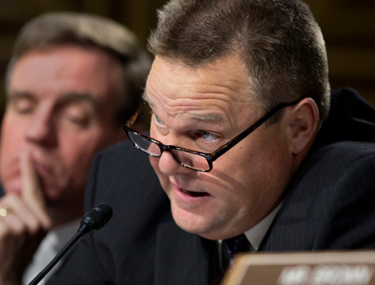 Sen. Jon Tester, D-Mont., right, shown here Nov. 14, said that providing adequate funding for the federal inspectors general could be a way to fix the national debt. (AP Photo/J. Scott Applewhite)
