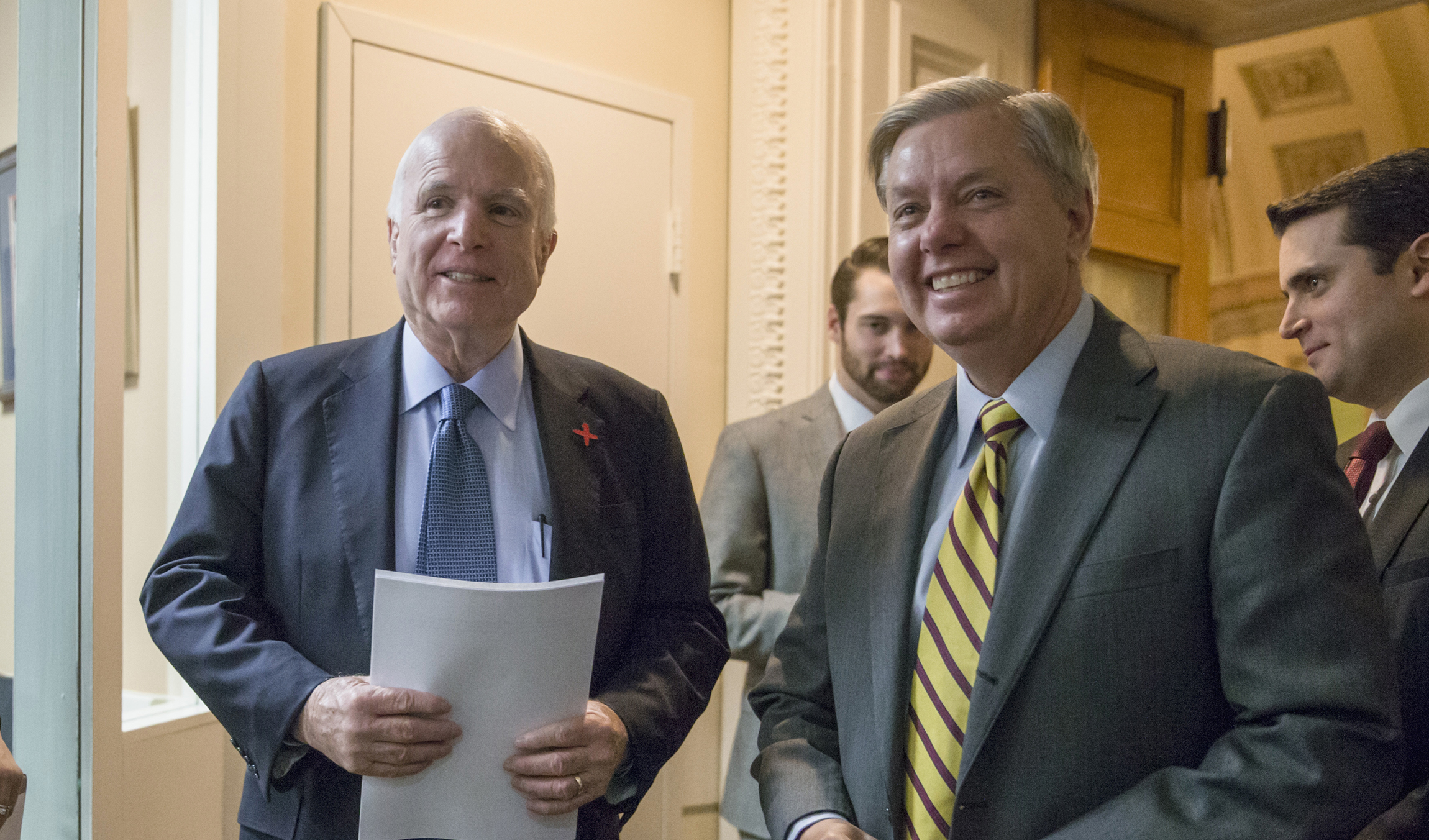 John McCain and Lindsey Graham attend economic conference in Italy