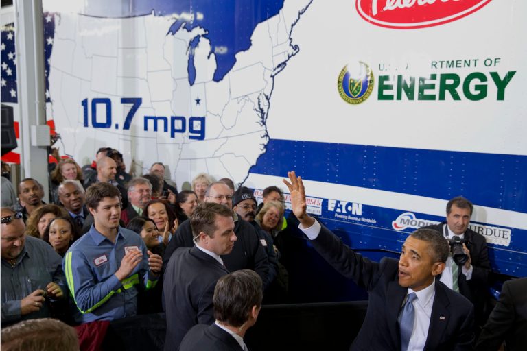 President Barack Obama waves after speaking about how having a fuel-efficient truck fleet will boost the economy and help combat climate change, Tuesday, Feb. 18, 2014 at the Safeway Distribution Center in Upper Marlboro, Md. (AP Photo/Jacquelyn Martin)