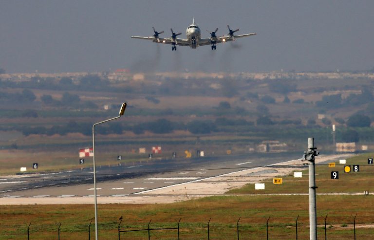 A United States Navy plane approaches to land at the Incirlik Air Base, in Adana, in the outskirts of the city of Adana, southeastern Turkey, Tuesday, July 28, 2015. (AP Photo/Emrah Gurel)