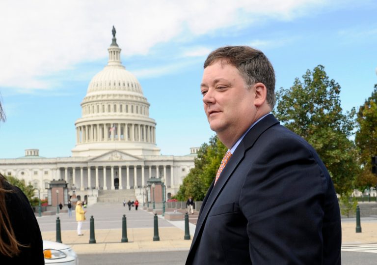 Republican activist Shaun McCutcheon of Hoover, Ala., walks past the Capitol as he leaves the Supreme Court in Washington, Tuesday, Oct. 8, 2013, after the court's hearing on campaign finance. (AP/Susan Walsh)