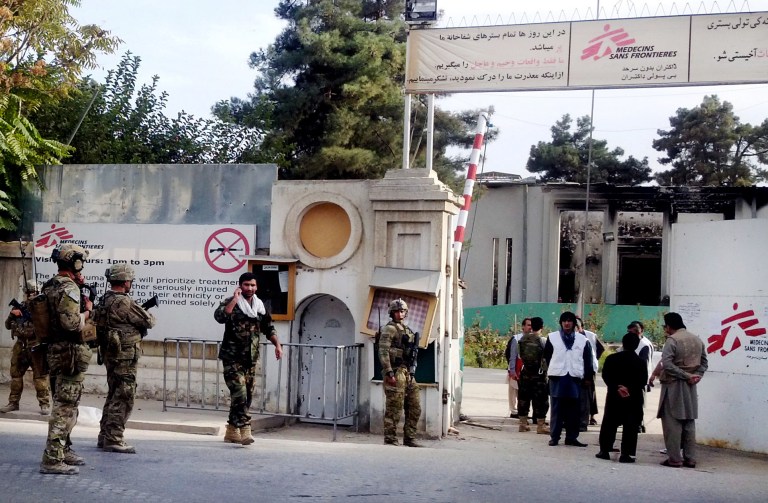 U.S. soldiers walk into the charred remains of the Doctors Without Borders hospital in Kunduz, Afghanistan. (AP Photo/Najim Rahim, File)