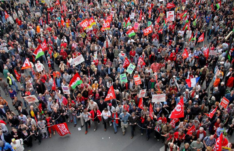 Demonstrators walk during a rally to protest against the austerity measures announced by the French government, in Paris, Sunday, May 5, 2012. (AP Photo/Michel Spingler)