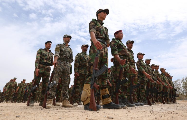 Sunni tribal volunteers stand in formation during their graduation ceremony in the town of Amiriyat al-Fallujah, west of Baghdad, Iraq, Friday, May 8, 2015. (AP)