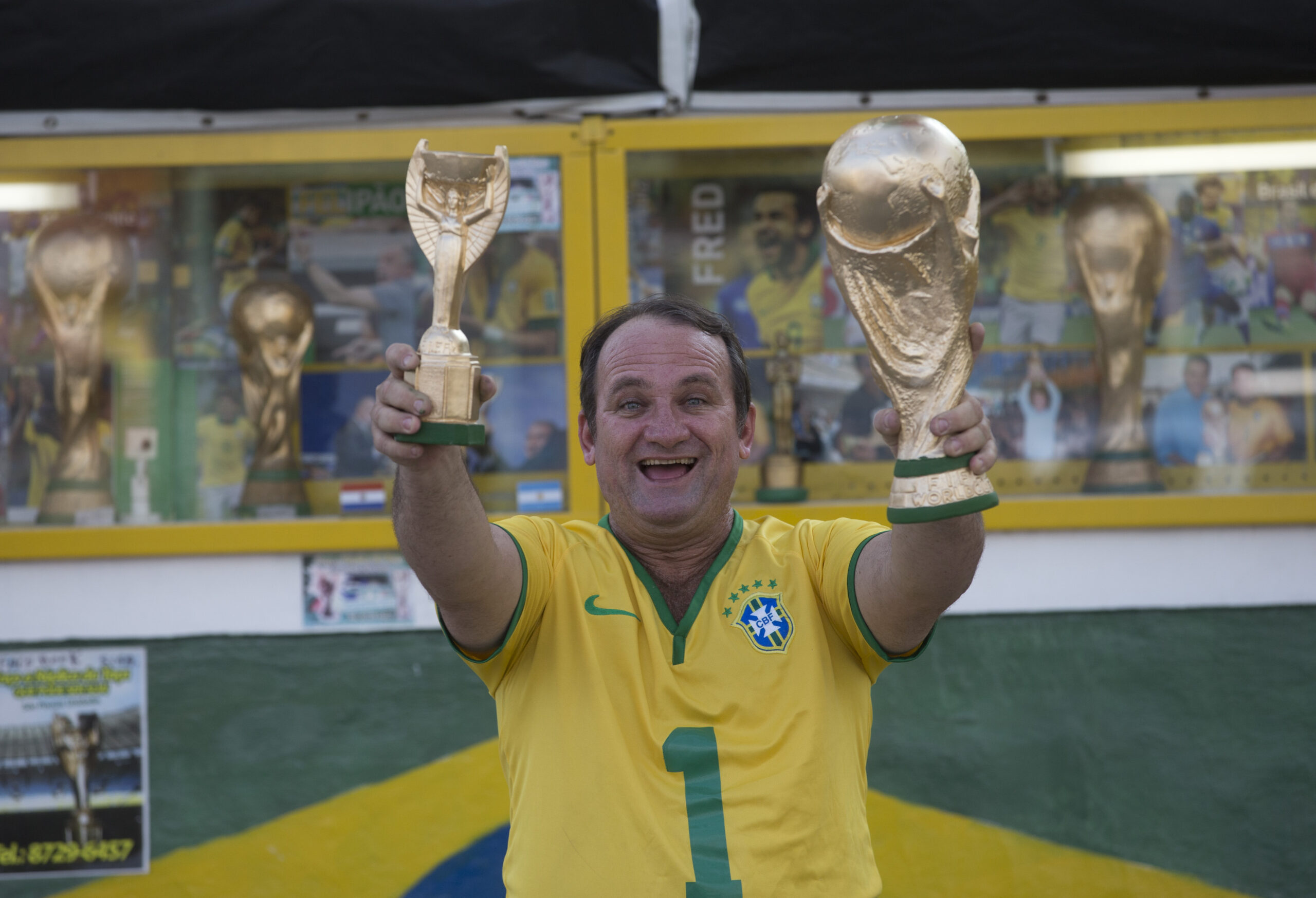 AP PHOTOS: Fan makes replica World Cup trophies