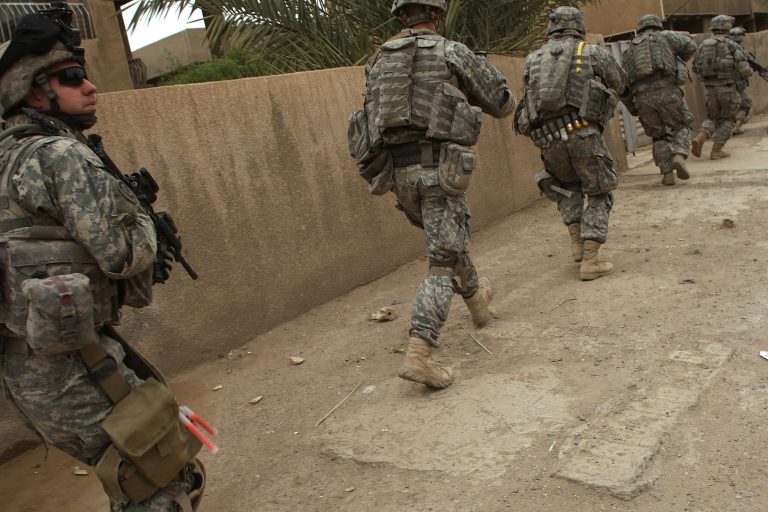Members of U.S. Army Eagle Company 2-2 Cavalry Regiment patrol in the Hadar neighborhood March 10, 2008 in Baghdad, Iraq. (Photo by Spencer Platt/Getty Images)