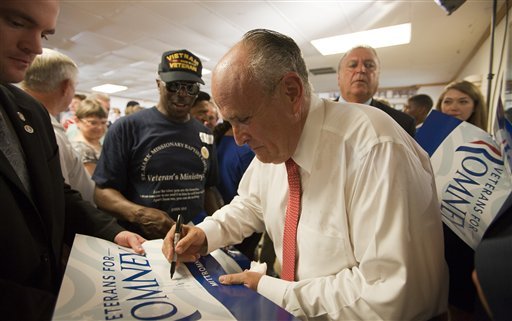 Former New York City Mayor Rudy Giuliani signs autographs for supporters of Mitt Romney after his remarks in support of Romney in Virginia Beach. Giuliani is among Romney's potential vice-presidential candidates. (AP photo)