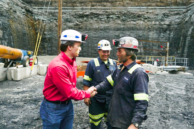 George Dethlefsen, left, CEO of Corsa Coal, speaks with a miner in a coal pit in Friedens, Pa., on June 7. Corsa Coal Corp. says the mine will create 70 to 100 new jobs and produce some 400,000 tons of metallurgical coal a year. President Trump has referred to the mine's opening during speeches announcing his intent to withdraw from the Paris climate accords. (AP Photo/Dake Kang)