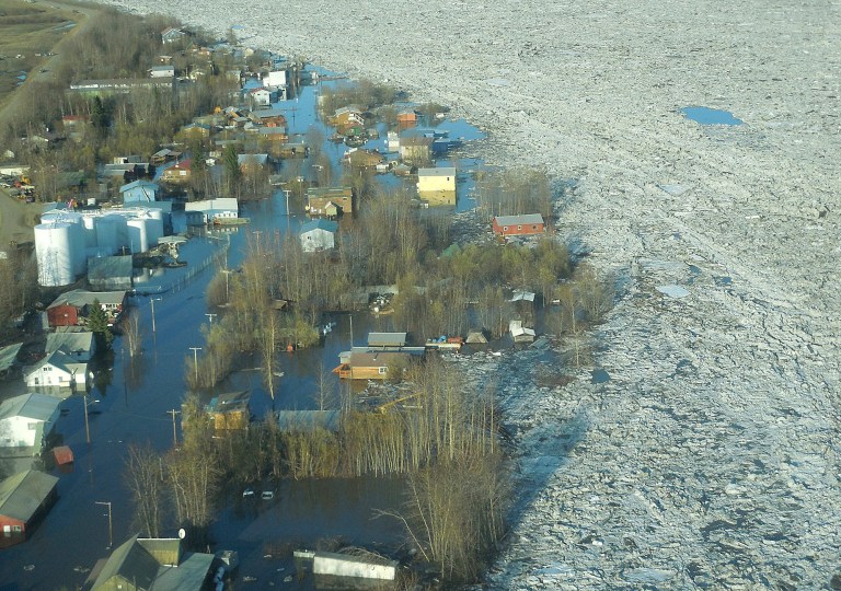 In this May 27, 2013 photo released by the National Weather Service, ice and water are shown flooding homes and other buildings in Galena, Alaska. Several hundred people are estimated to have fled the community of Galena in Alaska's interior, where a river ice jam has caused major flooding, sending water washing over roads and submerging buildings. (AP Photo/National Weather Service, Ed Plumb)