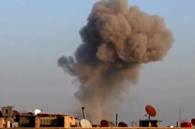   In this image taken from video obtained from the Shaam News Network, which has been authenticated based on its contents and other AP reporting, smoke rises from buildings from heavy shelling in Damascus, Syria, on Thursday, Dec. 27, 2012. (AP Photo/Shaam News Network via AP video)  