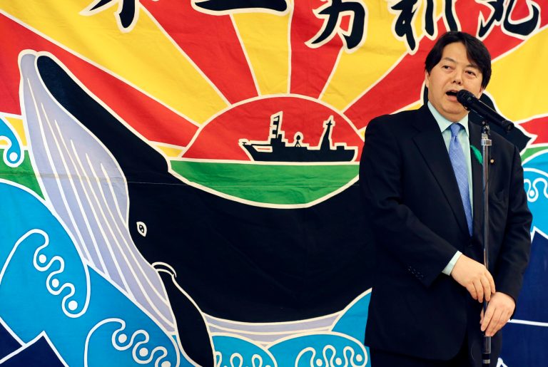 FILE - In this Tuesday, April 15, 2014 file photo, Japan's Agriculture, Forestry and Fisheries Minister Yoshimasa Hayashi speaks during the 26th whale meat tasting event in Tokyo. Japan will target fewer whales when the Pacific hunt begins next week and will limit next season's Antarctic whaling to observation. The decisions came Friday, April 18, after the International Court of Justice ordered Japan last month to suspend Antarctic whaling. The court said the program was commercial, not scientific as Japan had contended. Hayashi said Friday that the Pacific catch target was being slashed to about 210 from the current 380. (AP Photo/Koji Sasahara, File)