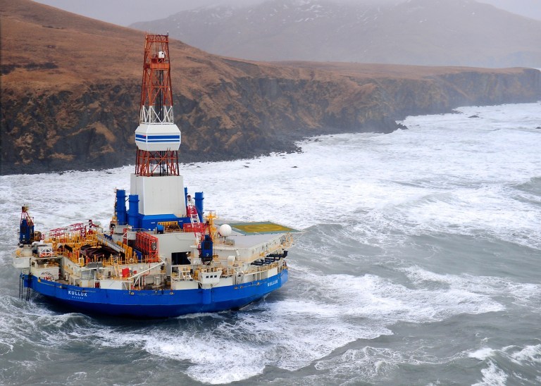 An Image provided by the U.S. Coast Guard shows the Royal Dutch Shell drilling rig Kulluk aground off a small island near Kodiak Island in Alaska in January 2013. (AP Photo/U.S. Coast Guard)