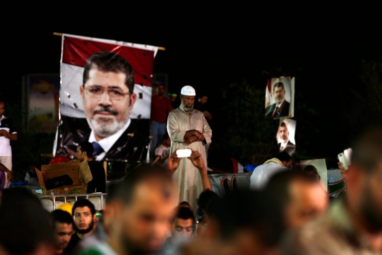Supporters of Egypt's ousted President Mohammed Morsi pray outside Rabaah al-Adawiya mosque, where they have installed a camp and hold daily rallies at Nasr City, in Cairo, Egypt. (AP/Hassan Ammar)