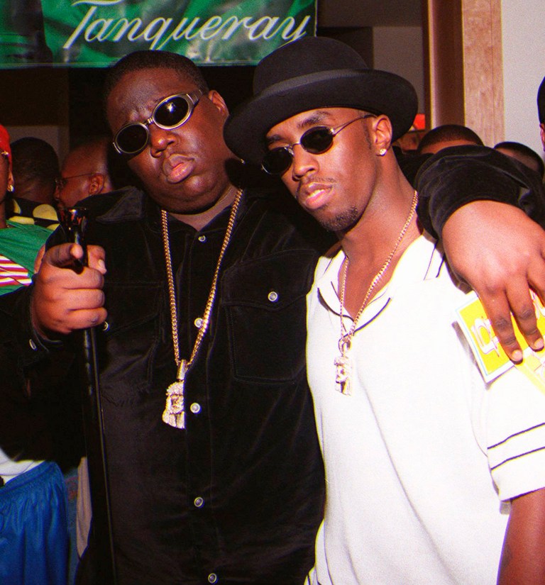   **FILE**In this March 8, 1997 file photo, Notorious B.I.G., whose real name is Christopher Wallace, left, gestures as he and producer Sean 