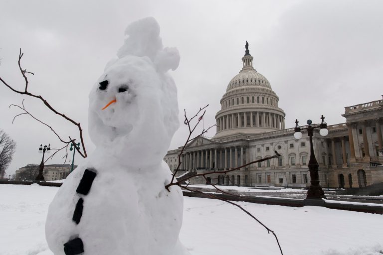 A snowman in the east front of the The U.S. Capitol Building is seen as a snow storm shuts down Washington, on Thursday, February 13, 2014. (Examiner/Graeme Jennings)