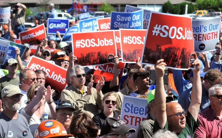 Miners and steel-industry supporters rally in Virginia Minn., Monday morning, June 23, 2014. Participants in the rally in Minnesota's Iron Range called for an end to foreign countries illegally dumping steel in the U.S. and threatening the local mining industry.Gov. Mark Dayton joined Monday's rally and urged iron miners to step up the fight. (AP Photo/Mesabi Daily News, Mark Sauer)