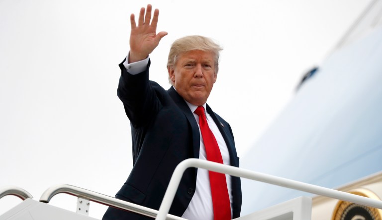 President Trump waves as he boards Air Force One as he departs at Andrews Air Force Base, Md. (AP Photo/Alex Brandon)