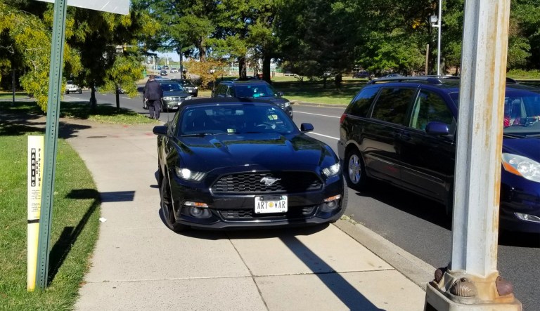 The picture shows what seems to be Gorka's signature Mustang convertible, with the license plate that reads 