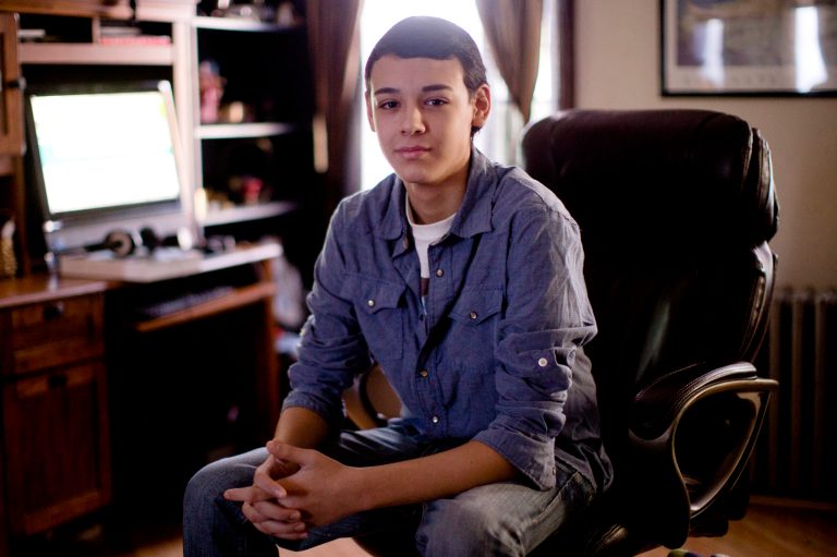 High school student Vito Calli, 15, poses for a portrait by his computer, Wednesday, Nov. 20, 2013, at his home in Reading, Pa. In a shift in attitude, most young people now say it's wrong to use racist or sexist slurs online, even if you're just kidding. But when they see them, they don't take much personal offense. Calli, whose family emigrated from Argentina, says people tease him online with jokes about Hispanics, but 