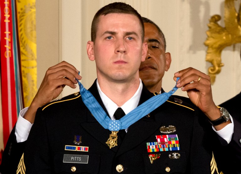 President Barack Obama bestows former Army Staff Sergeant Ryan M. Pitts with the Medal of Honor in the East Room of the White House Monday, July 21, 2014, in Washington. Pitts is the ninth living recipient of the nation's highest decoration for battlefield valor for actions in Iraq and Afghanistan.  (AP Photo/Jacquelyn Martin)