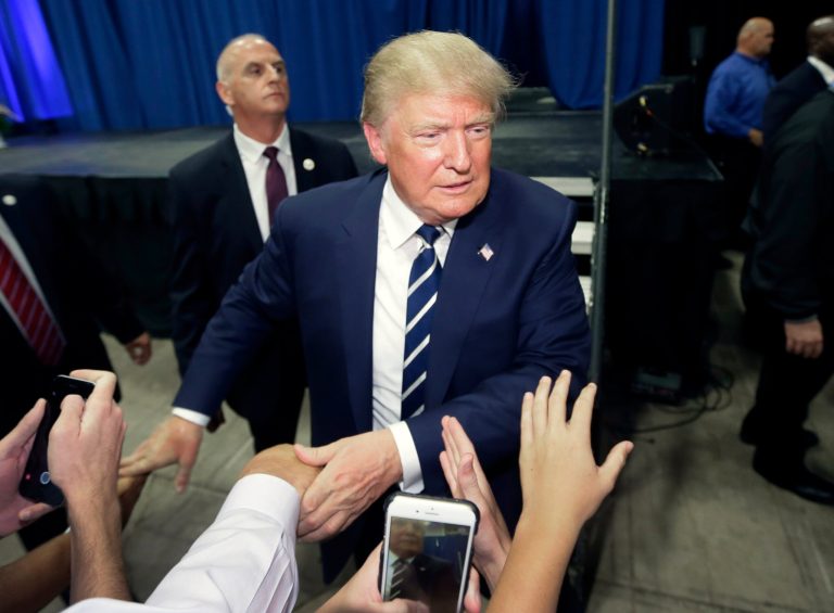 Republican presidential candidate Donald Trump greets supporters after addressing a GOP fundraising event. (AP Photo/Carlos Osorio)