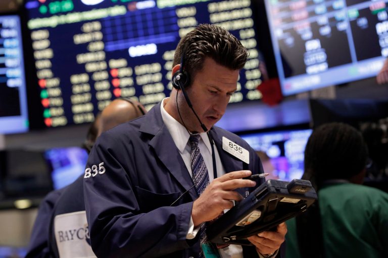 Trader Glenn Kessler works on the floor of the New York Stock Exchange Monday, July 28, 2014. The stock market is opening mixed at the start of a busy week as a batch of merger announcements lift shares in Family Dollar and other companies. (AP Photo/Richard Drew)