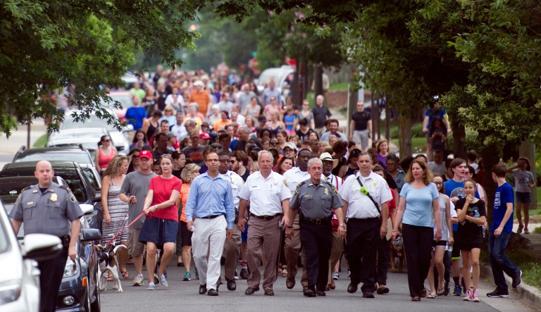 People walk to a church to say a prayer near the baseball field, the scene of a multiple shooting in Alexandria, Va. A rifle-wielding attacker opened fire on Republican lawmakers at a congressional baseball practice, wounding House GOP Whip Steve Scalise and several others. (AP Photo/Cliff Owen)