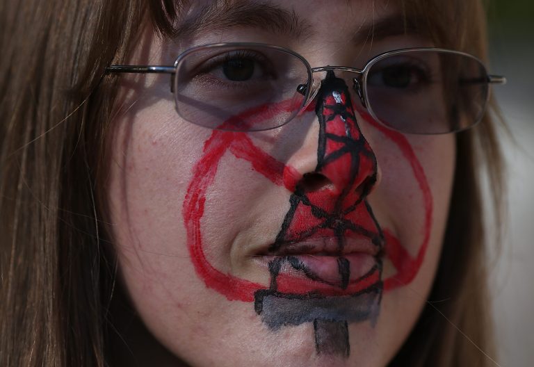SACRAMENTO, CA - JULY 25:  A protestor who identified herself as Kat wears face paint during a demonstration against fracking outside of the California Environmental Protection Agency (EPA) headquarters on July 25, 2012 in Sacramento, California. Dozens of environmental activists staged a 