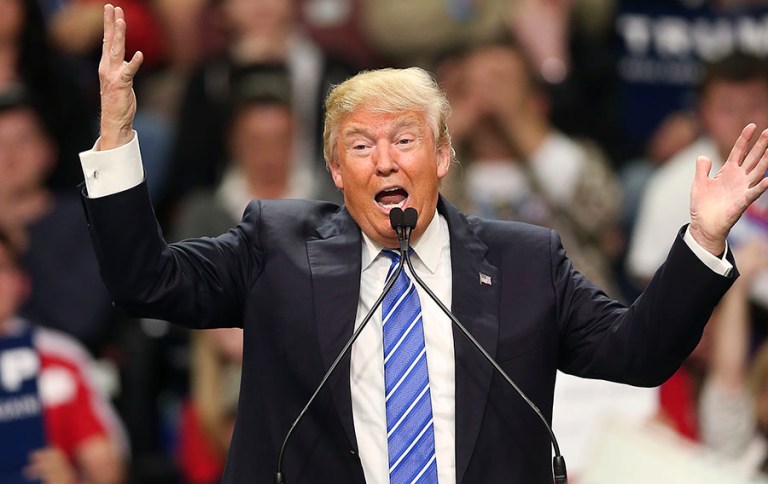 The survey found 33 percent of respondents said they were planning to vote for Trump in the Republican presidential primary on Tuesday. (AP Photo/John Bazemore)