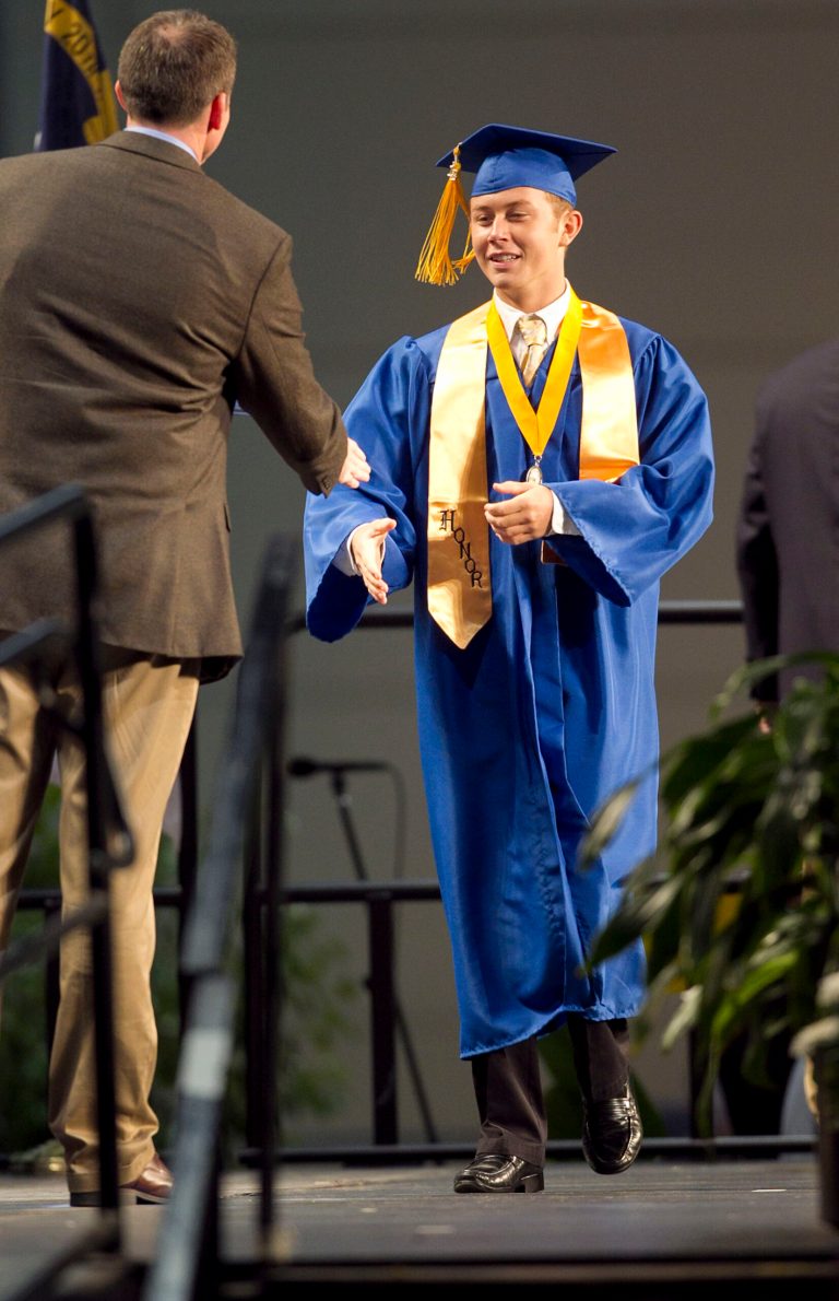   Garner High School graduate, and 2011 American Idol winner Scotty McCreery receives his diploma during commencement exercises at the Raleigh Convention Center on Thursday, June 7, 2012 in Raleigh, N.C. McCreery plans to attend N.C. State University in the fall. (AP Photo/The News & Observer, Robert Willett)  