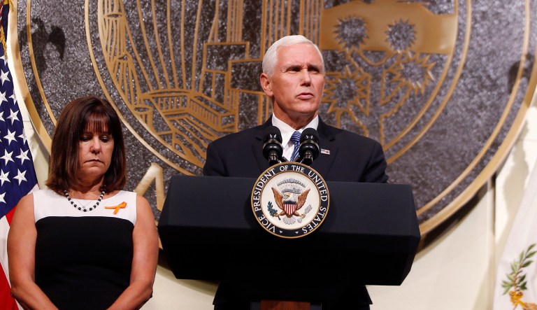 Both Pence and President Trump, who is currently overseas for a five-country tour through Asia, issued statements after the massacre and ordered all flags to be flown at half-staff through Thursday. (AP Photo/Isaac Brekken)