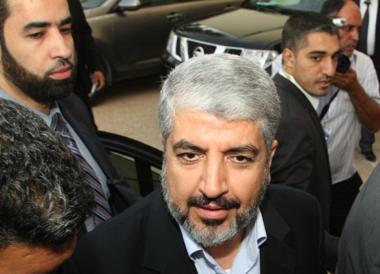   FILE - In this Thursday, July 12, 2012 file photo, Hamas leader Khaled Mashaal arrives at the Islamist Ennahda party congress in Tunis. The leader of Gaza's ruling Hamas group will visit the Palestinian territory for the first time, an official said Saturday, Dec. 1, 2012, a sign of increasing boldness of the Islamic militant movement after it held its own against an Israeli military offensive. Khaled Mashaal was set to arrive in the Gaza Strip next week by crossing the border from Egypt to mark Hamas' 25th anniversary and congratulate its leaders and fighters for battling Israel during the recent eight-day offensive, according to a senior Hamas official in Gaza. (AP Photo/Amine Landoulsi, File)  