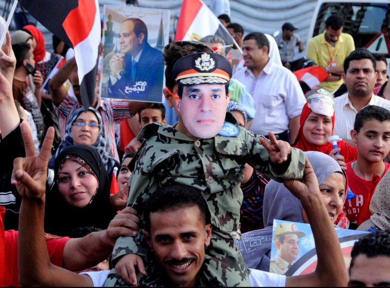 Supporters of Egypt's former military chief Abdel-Fattah el-Sissi react to the official announcement declaring him the next president of Egypt with 96.9 percent of the vote, and a turnout of 47.45 percent, in Alexandria, Egypt, Tuesday, June 3, 2014. El-Sissi's victory was never in doubt, but the career infantry officer had pushed for a massive turnout as well to bestow legitimacy on his ouster last July of Islamist President Mohammed Morsi and the ensuing crackdown on his Muslim Brotherhood and Islamist supporters. (AP Photo/Mohammed Asad)
