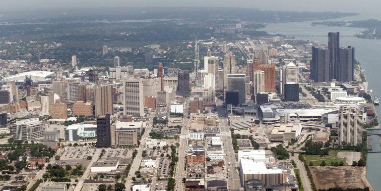 FILE- In this July 17, 2013, file aerial photo the city of Detroit is seen. Mediators announced Wednesday, April 9, 2014, that the city of Detorit reached a deal in bankruptcy over $388 million in bonds. It is a significant agreement that could influence other creditors to try to get a settlement. The deal still needs the blessing of Judge Steven Rhodes and is only a small part of the $18 billion bankruptcy case, the largest by a local government in U.S. history. (AP Photo/Paul Sancya, File)