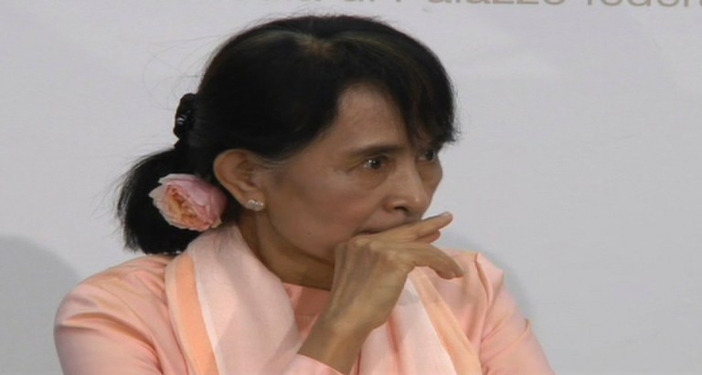   In this image taken from AP Television News Myanmar opposition leader Aung San Suu Kyi, puts her hand to mouth before becoming ill at a press confernce in Bern, Switzerland, Thursday, June 14, 2012. Suu Kyi said she felt exhausted after her long trip from Asia to Europe. A spokesman for the Swiss Foreign Ministry said Suu Kyi recovered enough to briefly attend a reception with government officials but then retired to her room. Suu Kyi was her first trip to Europe since 1988. (AP Photo/AP Television News) TV OUT  