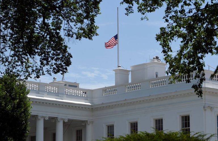 Flags will be lowered until Friday night to honor the three Baton Rouge police officers who were gunned down. (AP Photo/Susan Walsh)